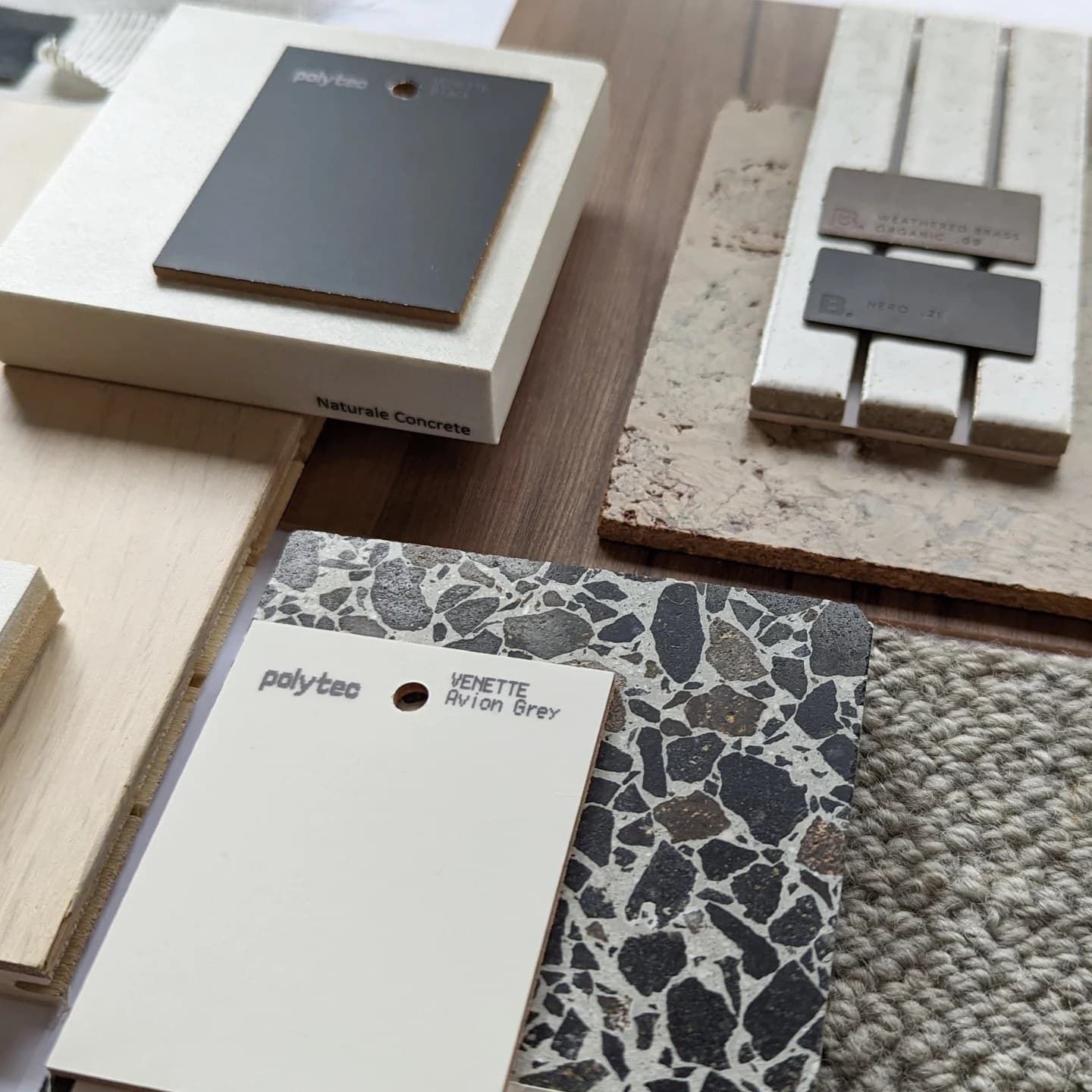 Close-up of laminate, terrazzo, concrete and wool carpet samples
