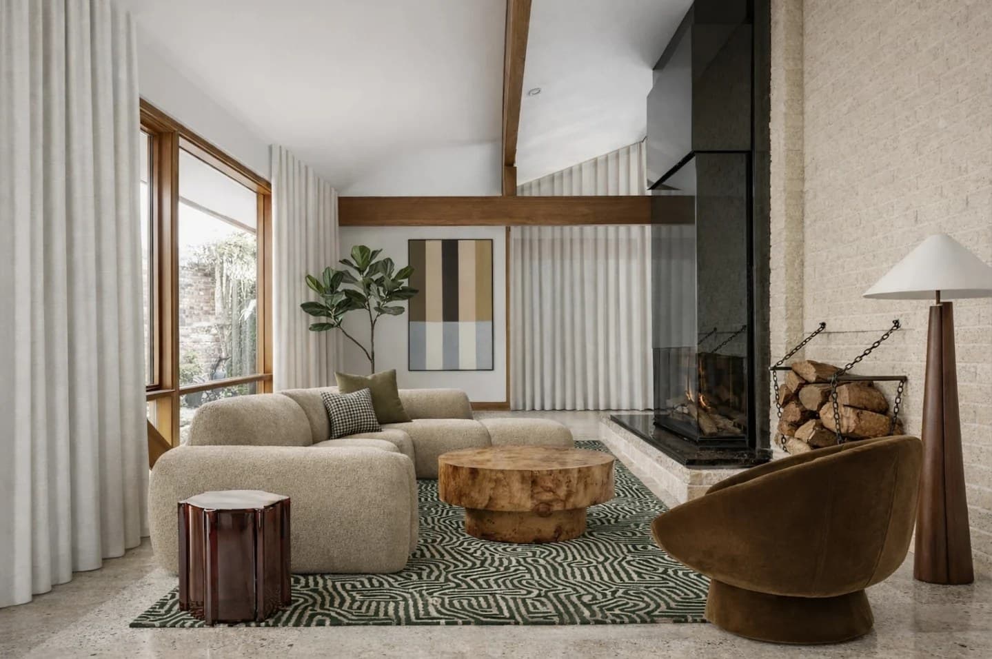 Mid-century living room with exposed timber beams, a painted brick fireplace wall, a bouclé modular sofa, a burl timber coffee table and a green patterned rug